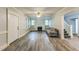 Bright living room with fireplace, ceiling fan, hardwood floors, and natural light at 500 Cokey Rd, Rocky Mount, NC 27801