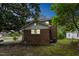 Home with a brick and white siding featuring windows and mature trees at 500 Cokey Rd, Rocky Mount, NC 27801