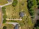 Aerial perspective of property showing house, expansive lawn and pond at 5013 W Pool Rd, Rougemont, NC 27572