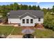 Aerial shot of backyard features a patio area with a hot tub at 5013 W Pool Rd, Rougemont, NC 27572