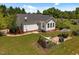 Aerial view of the backyard with patio, grill, and hot tub at 5013 W Pool Rd, Rougemont, NC 27572