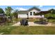 Backyard patio with grill, table, and hot tub, perfect for outdoor entertaining at 5013 W Pool Rd, Rougemont, NC 27572