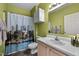 Clean bathroom features a shower with themed curtains, a white vanity, and plenty of space at 5013 W Pool Rd, Rougemont, NC 27572