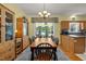 Bright dining room features classic chandelier and a large wooden table set at 5013 W Pool Rd, Rougemont, NC 27572