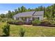 Traditional single story home offers a cozy front porch and well manicured lawn at 5013 W Pool Rd, Rougemont, NC 27572