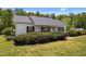 Well maintained home shows an inviting covered front porch and mature plantings at 5013 W Pool Rd, Rougemont, NC 27572