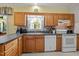 Efficient kitchen with tile backsplash, countertops, and modern appliances at 5013 W Pool Rd, Rougemont, NC 27572