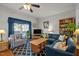 Cozy living room features comfortable seating, hardwood floors and lots of light at 5013 W Pool Rd, Rougemont, NC 27572
