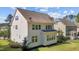 Expansive backyard with lush green grass and a charming two-story home at 5145 Landguard Dr, Raleigh, NC 27613