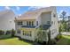Two-story home featuring a private backyard, lush lawn, and an outdoor patio at 5145 Landguard Dr, Raleigh, NC 27613