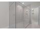 Bathroom with a frameless shower with built in bench and tiled surround at 5145 Landguard Dr, Raleigh, NC 27613