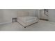Bedroom with soft carpet and tufted headboard, offering a calm aesthetic at 5145 Landguard Dr, Raleigh, NC 27613