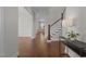 Open foyer showcasing hardwood floors, staircase, and a view into the living spaces beyond at 5145 Landguard Dr, Raleigh, NC 27613