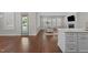 Bright living room features hardwood floors, fireplace, and access to outdoor space at 5145 Landguard Dr, Raleigh, NC 27613