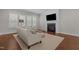 Bright living room features a fireplace, plantation shutters, and hardwood floors at 5145 Landguard Dr, Raleigh, NC 27613