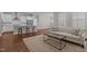 Open-concept living room and kitchen with stainless steel appliances and breakfast bar at 5145 Landguard Dr, Raleigh, NC 27613