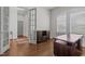 Home office with hardwood floors, custom desk, and natural light at 5145 Landguard Dr, Raleigh, NC 27613