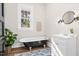 Charming bathroom featuring a clawfoot tub and a modern vanity at 5299 Momeyer Way, Nashville, NC 27856