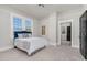 Bright bedroom with a comfy bed, large windows, and neutral colors creating a relaxing atmosphere at 5299 Momeyer Way, Nashville, NC 27856