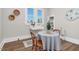 Charming breakfast nook with vintage sink, wood floors and a round table perfect for cozy meals at 5299 Momeyer Way, Nashville, NC 27856