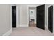 Hallway with hardwood floors, leading to a bathroom with a clawfoot tub at 5299 Momeyer Way, Nashville, NC 27856