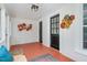 Cozy sunroom featuring vintage rug and colorful floral art, perfect for relaxing or entertaining guests at 5299 Momeyer Way, Nashville, NC 27856