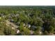 Overhead view of a beautiful community with lush trees and well-maintained homes, creating a serene atmosphere at 5417 Harrington Grove Dr, Raleigh, NC 27613