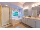 Bright primary bathroom with separate shower and bathtub, and double sinks at 5417 Harrington Grove Dr, Raleigh, NC 27613