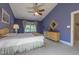 Comfortable bedroom features a vaulted ceiling, light carpet, and a charming dresser at 5417 Harrington Grove Dr, Raleigh, NC 27613