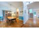 Bright dining room featuring hardwood floors and staircase to the second floor at 5417 Harrington Grove Dr, Raleigh, NC 27613