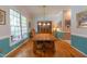Inviting dining room featuring hardwood floors and a classic wooden dining table at 5417 Harrington Grove Dr, Raleigh, NC 27613