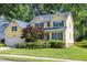 Attractive two-story home with colorful shrubbery and well maintained lawn at 5417 Harrington Grove Dr, Raleigh, NC 27613