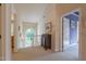 Hallway with natural light and view of the backyard, featuring a classic secretary desk at 5417 Harrington Grove Dr, Raleigh, NC 27613