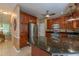 This kitchen features stainless steel appliances, granite countertops, a central island, and wood cabinetry at 5417 Harrington Grove Dr, Raleigh, NC 27613