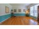 Spacious living room with hardwood floors and ample natural light from the large windows at 5417 Harrington Grove Dr, Raleigh, NC 27613