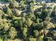 Serene aerial view showcasing homes nestled among mature trees in a quiet neighborhood at 5812 N Beaver Ln, Raleigh, NC 27604