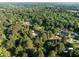 Picturesque aerial view of wooded neighborhood with lush greenery and well-maintained homes at 5812 N Beaver Ln, Raleigh, NC 27604