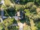 Overhead shot of a home with lush landscaping and a large driveway at 5812 N Beaver Ln, Raleigh, NC 27604