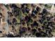 Property lines of land in a wooded neighborhood surrounded by mature trees and well-maintained homes at 5812 N Beaver Ln, Raleigh, NC 27604