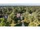 Aerial view of a charming home with lush trees in a well-established neighborhood at 5812 N Beaver Ln, Raleigh, NC 27604