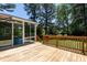 Wooden deck off the back of the home leading to a screened in porch at 5812 N Beaver Ln, Raleigh, NC 27604