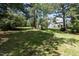 Spacious backyard with mature trees providing shade and privacy at 5812 N Beaver Ln, Raleigh, NC 27604