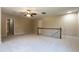 Spacious bonus room featuring neutral paint, plush carpet and a ceiling fan at 5812 N Beaver Ln, Raleigh, NC 27604