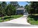 Charming two-story home featuring a three-car garage, well-manicured lawn, and a long driveway at 5812 N Beaver Ln, Raleigh, NC 27604