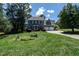 Traditional two-story home with attached garage, landscaped yard, and classic design at 5812 N Beaver Ln, Raleigh, NC 27604
