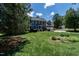 Classic two-story home with a lush green lawn and an attached two-car garage at 5812 N Beaver Ln, Raleigh, NC 27604