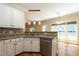Kitchen sink featuring stainless appliances, granite counters, and white cabinets at 5812 N Beaver Ln, Raleigh, NC 27604