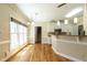 Bright eat-in kitchen with stainless appliances and hardwood floors at 5812 N Beaver Ln, Raleigh, NC 27604