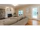Inviting living room with fireplace and access to the outdoor patio at 5812 N Beaver Ln, Raleigh, NC 27604