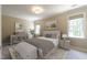 Serene main bedroom with soft lighting and neutral tones at 5812 N Beaver Ln, Raleigh, NC 27604